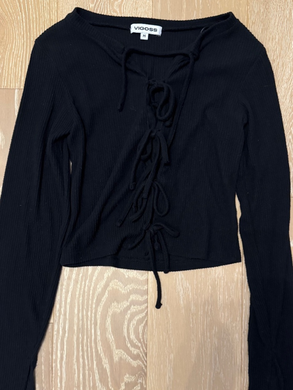 Black knit top with tie ups all the way down